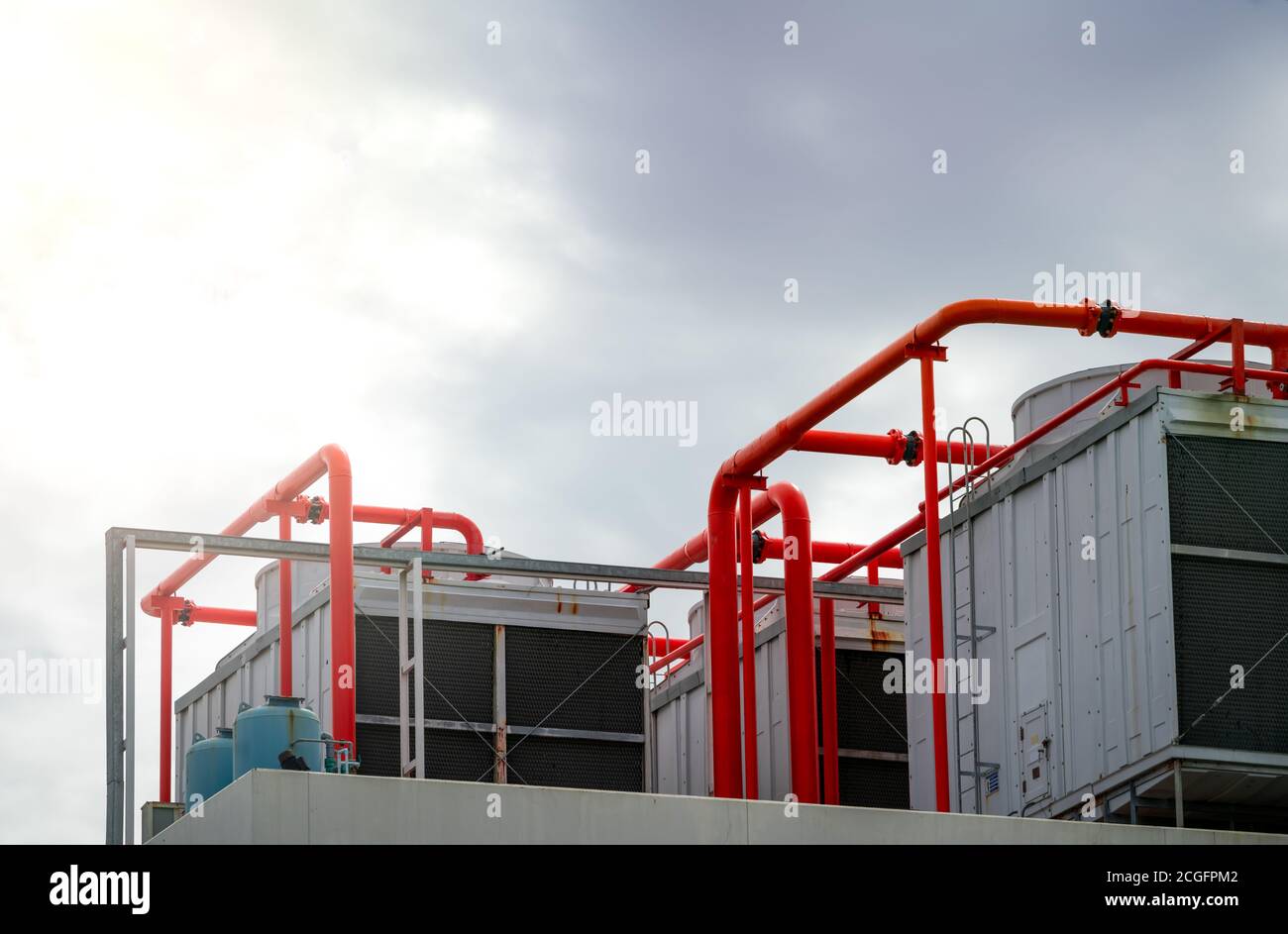 Cooling tower on roof top of building. Industrial air cooling system. Air  chiller. Unit of air conditioner. Air cooled chiller with piping system  Stock Photo - Alamy