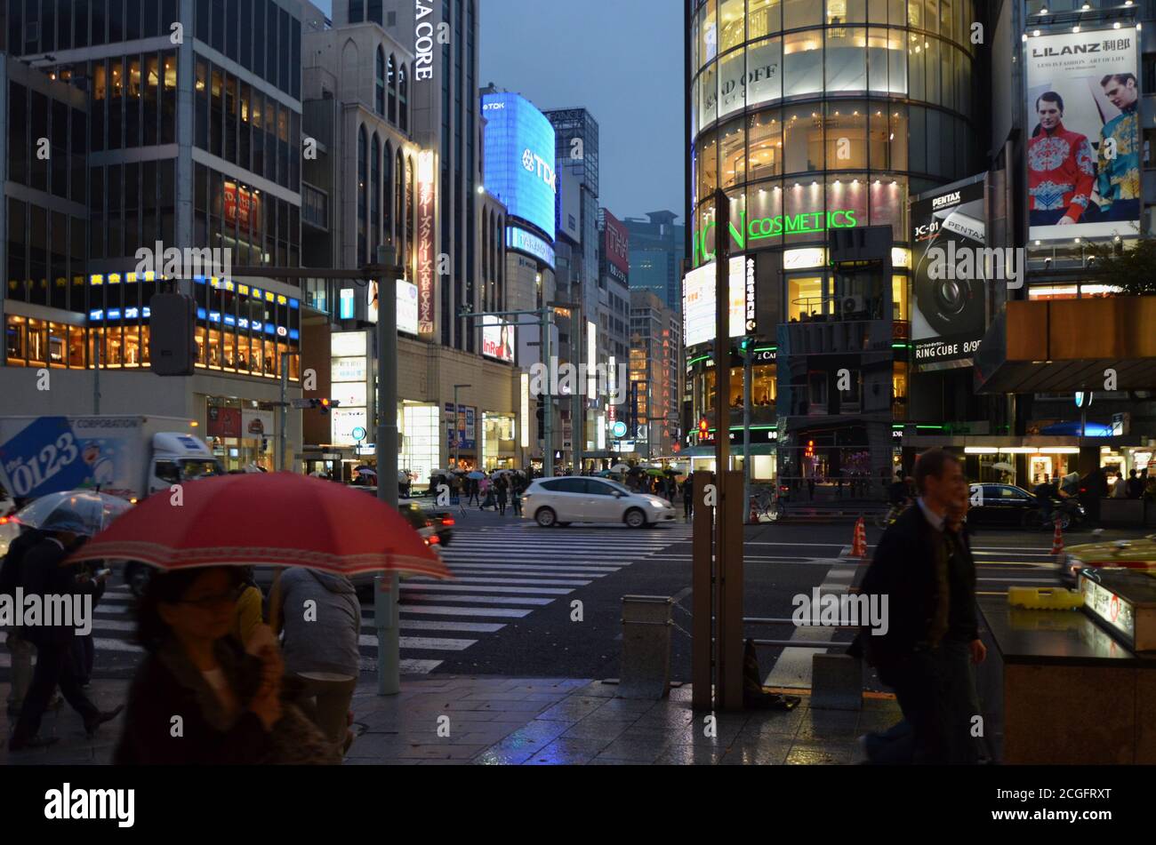 Ginza Crossroad between Chuo Dori and Ha, Tokyo at a rainy evening Stock Photo