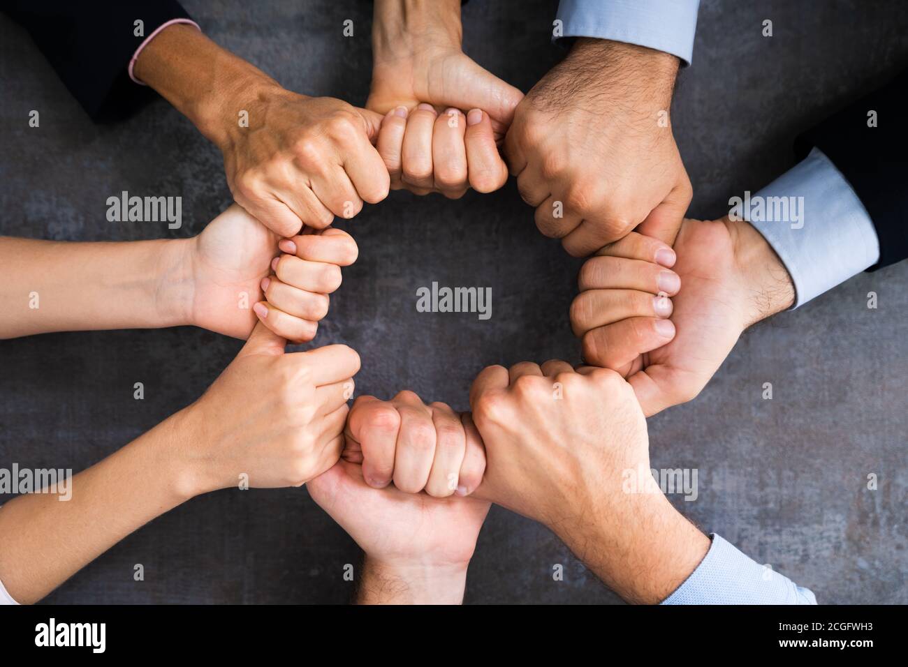 Team Hands Together In Circle. Group Cohesion Stock Photo
