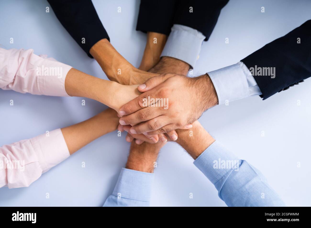 Business People Team Spirit And Employee Huddle Stock Photo