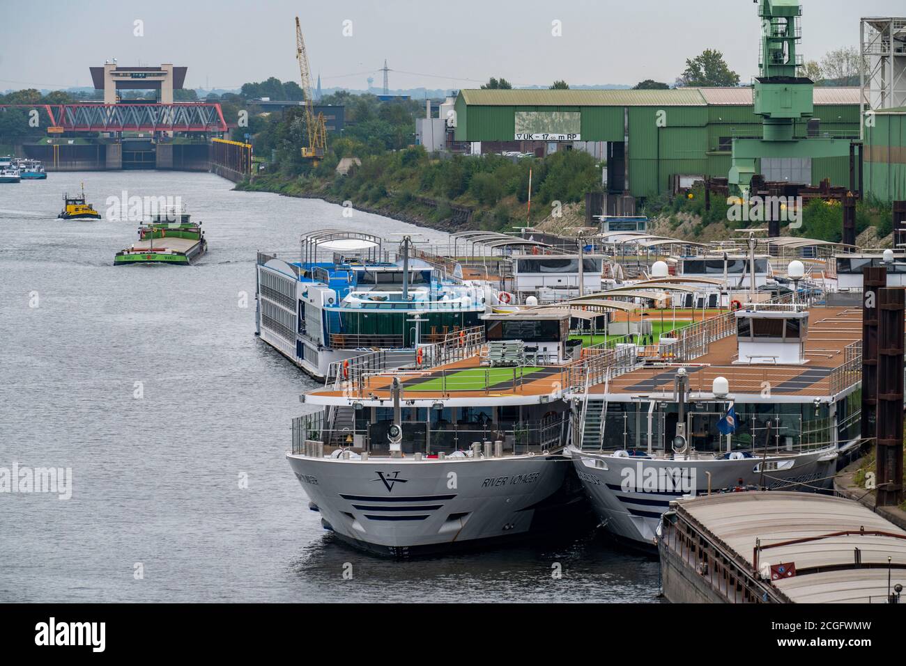 River cruise ships of various shipping companies are anchored in Duisburg's Ruhrort Port, they are not needed due to declining passenger numbers durin Stock Photo
