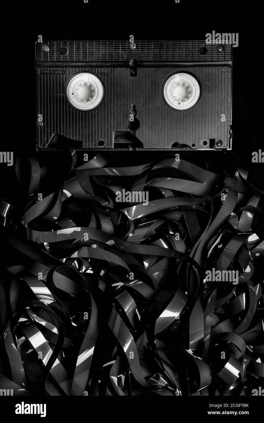 recording tape from an old VHS video recorder in a large tangled messy pile, with the