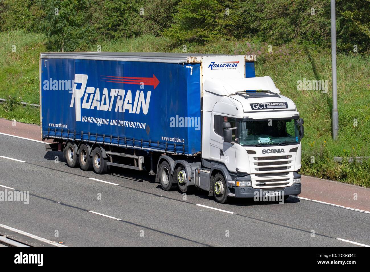 RoadTrain GCT Transport Ltd Haulage delivery trucks, lorry, transportation, truck, cargo carrier, vehicle, European commercial transport industry HGV, M6 at Manchester, UK Stock Photo