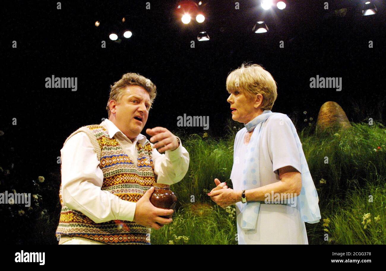 Simon Russell Beale (Felix Humble - holding the urn containing his father's ashes) with Diana Rigg (Flora Humble) in HUMBLE BOY by Charlotte Jones at the Cottesloe Theatre, National Theatre (NT), London SE1  09/08/2001  set design: Tim Hatley costumes: Lucy Roberts lighting: Paul Pyant director: John Caird Stock Photo