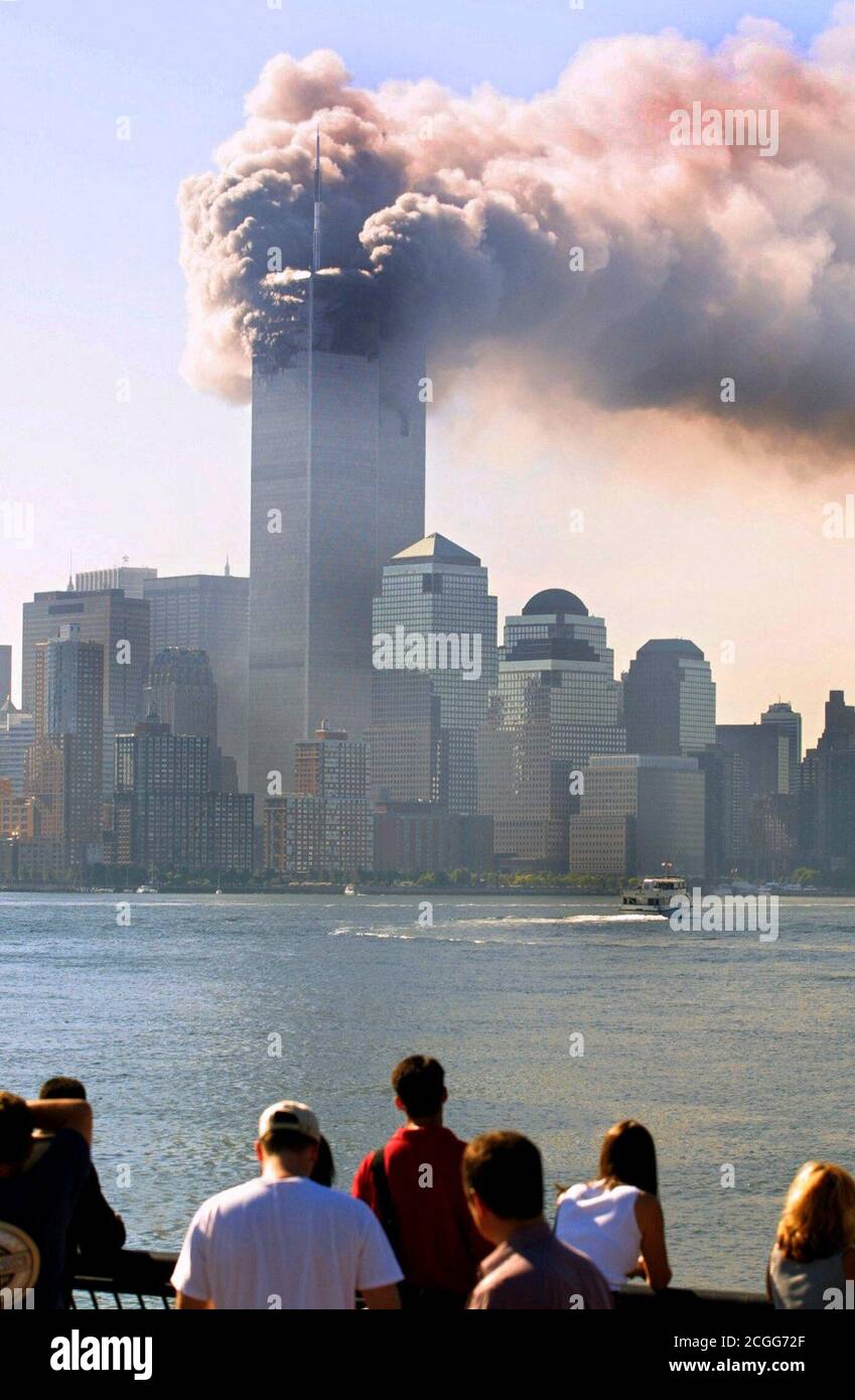 https://c8.alamy.com/comp/2CGG72F/view-from-staten-island-to-the-burning-world-trade-center-in-new-york-after-the-attack-on-september-11-2001-this-morning-two-planes-raced-into-the-towers-of-the-world-trade-center-in-quick-succession-in-addition-to-the-occupants-of-the-machines-numerous-people-were-killed-inside-the-two-skyscrapers-in-the-heavy-explosions-apparently-it-is-a-targeted-attack-by-terrorist-suicide-bombers-the-upper-parts-of-the-skyscraper-went-up-in-flames-parts-of-the-wreckage-and-buildings-of-the-411-meter-high-twin-towers-flew-onto-the-street-with-a-perfectly-clear-view-the-machines-had-raced-into-the-2CGG72F.jpg