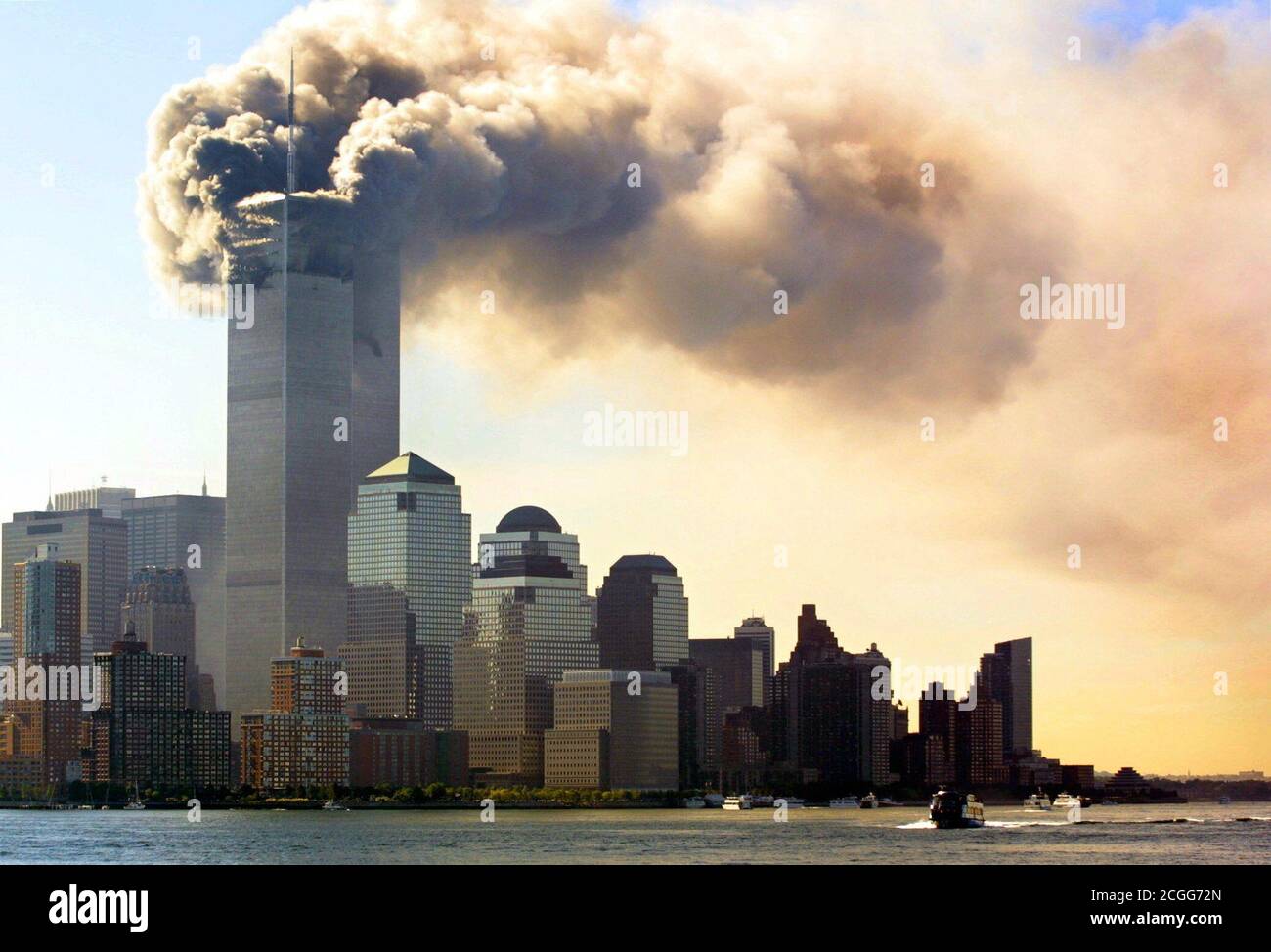 https://c8.alamy.com/comp/2CGG72N/view-of-the-burning-world-trade-center-in-new-york-after-the-attack-on-september-11-2001-this-morning-two-planes-raced-into-the-towers-of-the-world-trade-center-in-quick-succession-in-addition-to-the-occupants-of-the-machines-numerous-people-were-killed-inside-the-two-skyscrapers-in-the-heavy-explosions-apparently-it-is-a-targeted-attack-by-terrorist-suicide-bombers-the-upper-parts-of-the-skyscraper-went-up-in-flames-parts-of-the-wreckage-and-buildings-of-the-411-meter-high-twin-towers-flew-onto-the-street-with-a-perfectly-clear-view-the-machines-had-raced-into-the-houses-within-18-mi-2CGG72N.jpg