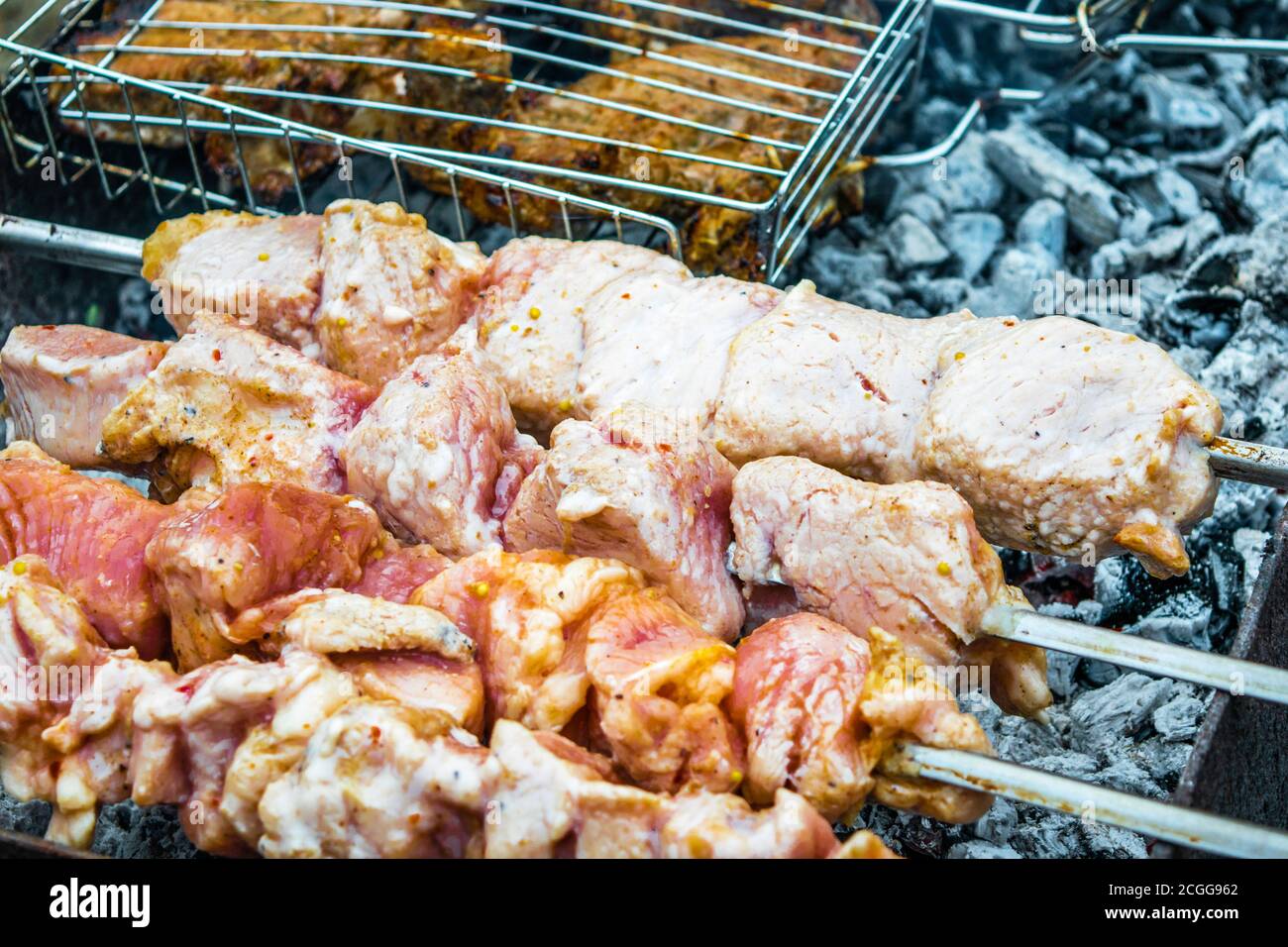 grilled meat on the charcoal grill. Embers smoke ash Stock Photo - Alamy