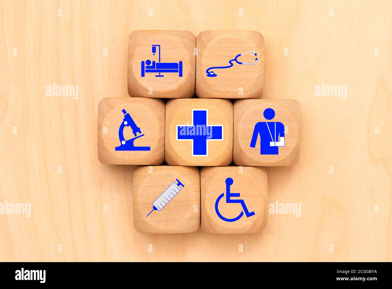 Medical care as a symbol on wooden cubes Stock Photo