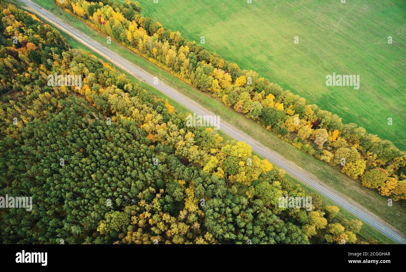 Long railroad  aerial view in yellow autumn landscape Stock Photo