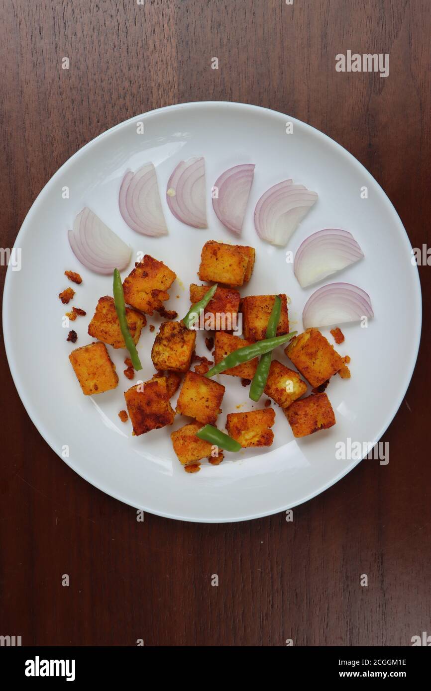 Tawa paneer or pan fried Paneer, Indian starter made with cottage cheese and spices, appetizer Stock Photo