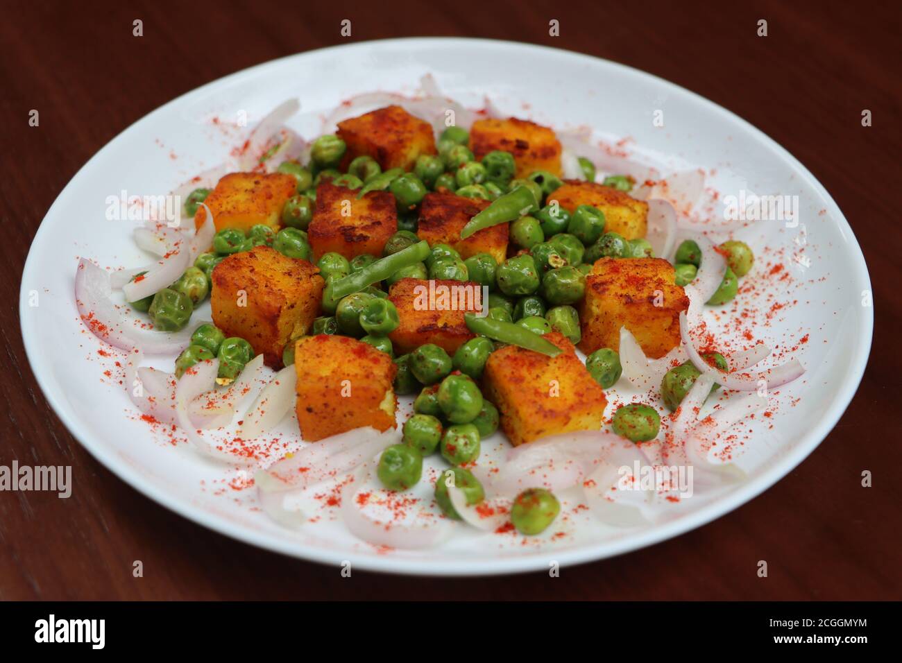 Tawa Paneer, Roasted Green peas and paneer salad, tawa fry, appetizer or starter Stock Photo