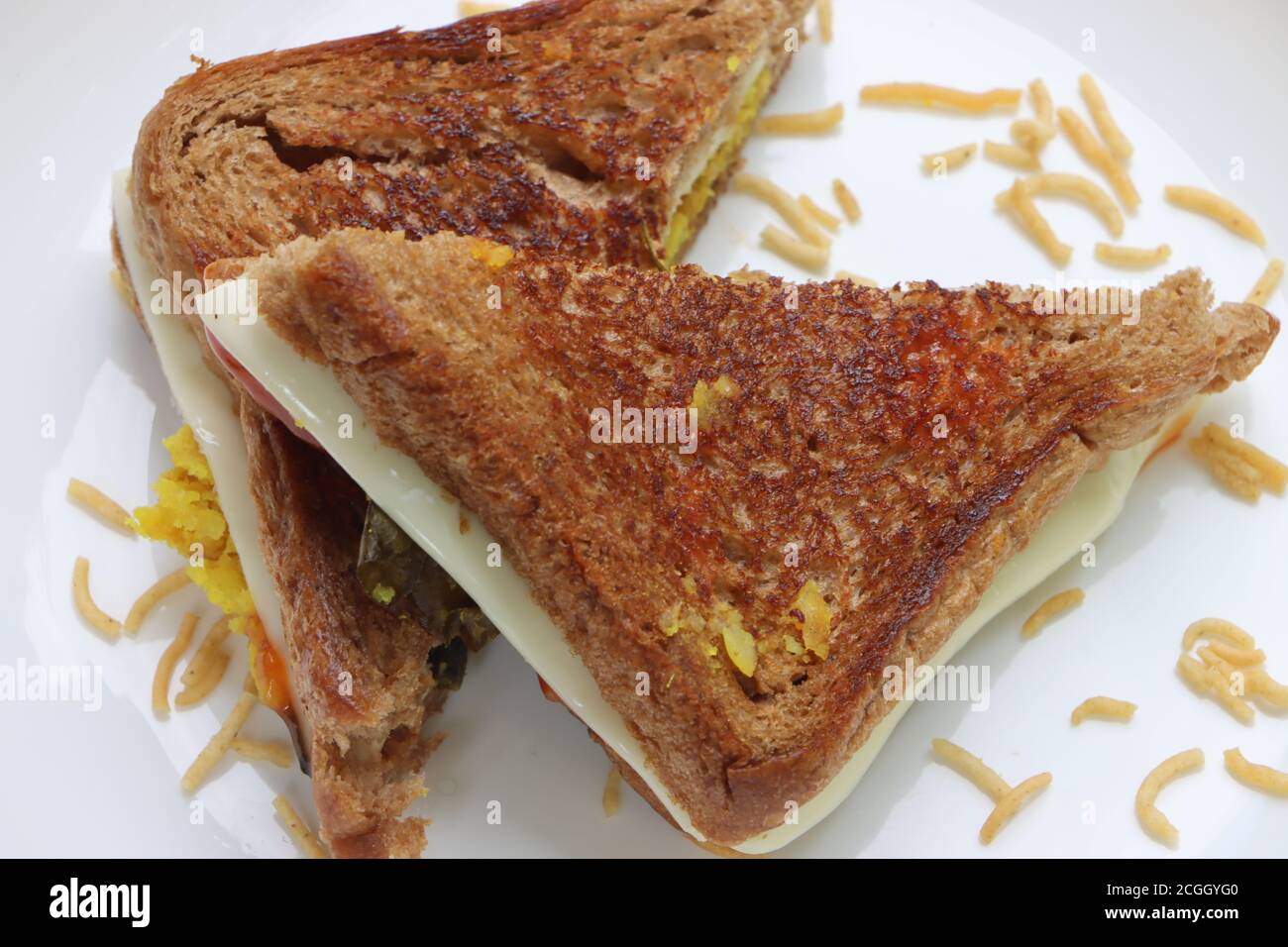 Homemade vegetable cheese grilled sandwich, brown bread breakfast Stock