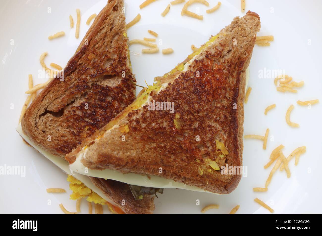 Homemade vegetable cheese grilled sandwich, brown bread breakfast Stock