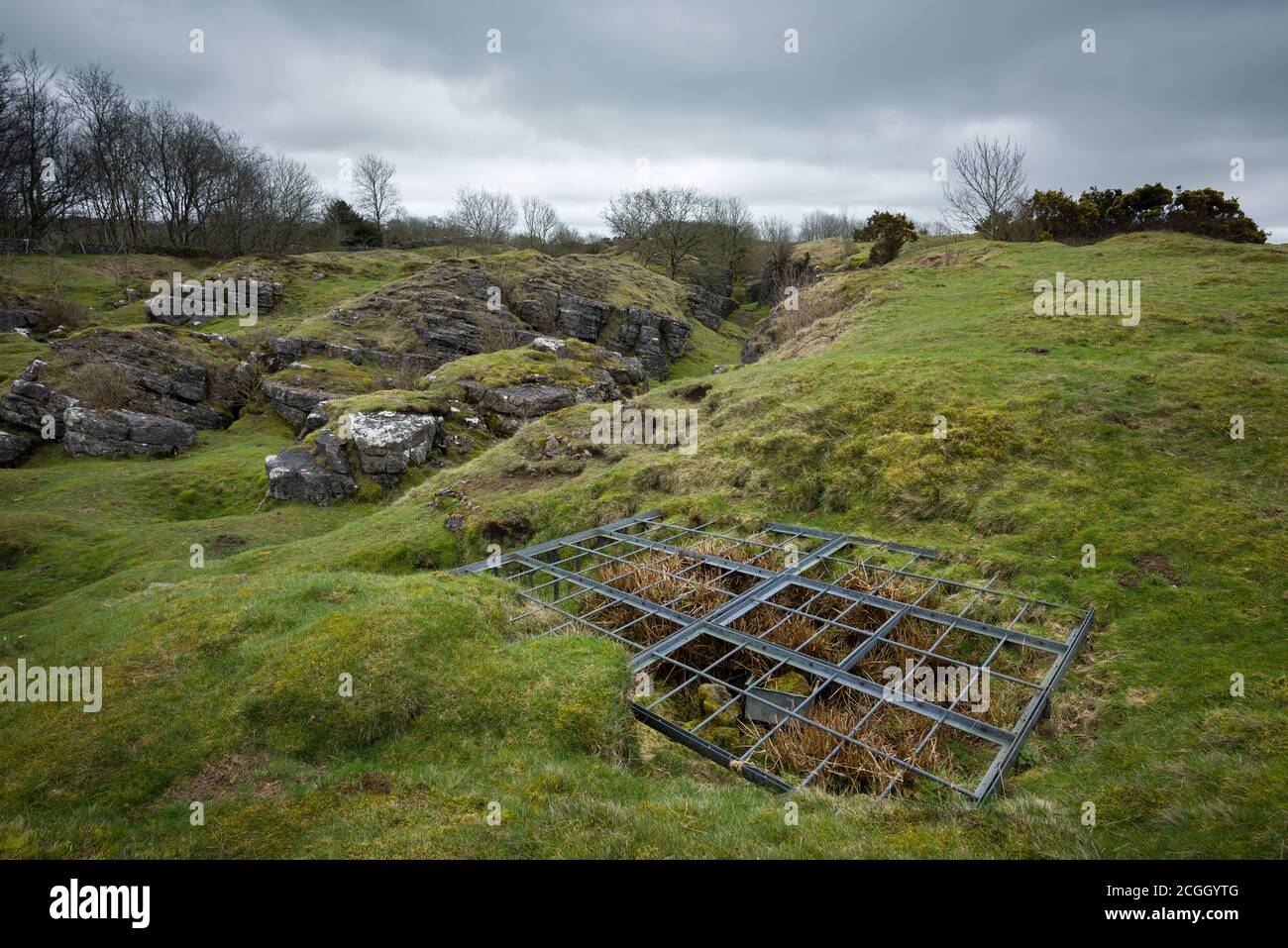 Grating over an exposed mineshaft at the old lead mines at Ubley Warren in the Mendip Hills, Somerset, England. Stock Photo