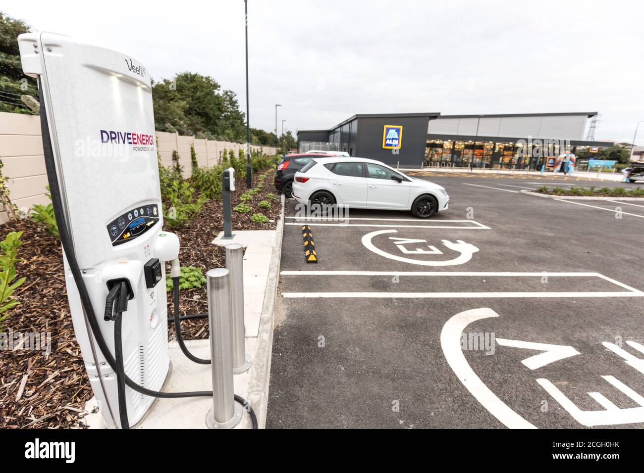 Aldi Supermarket car park with electric vehicle charging point Stock Photo
