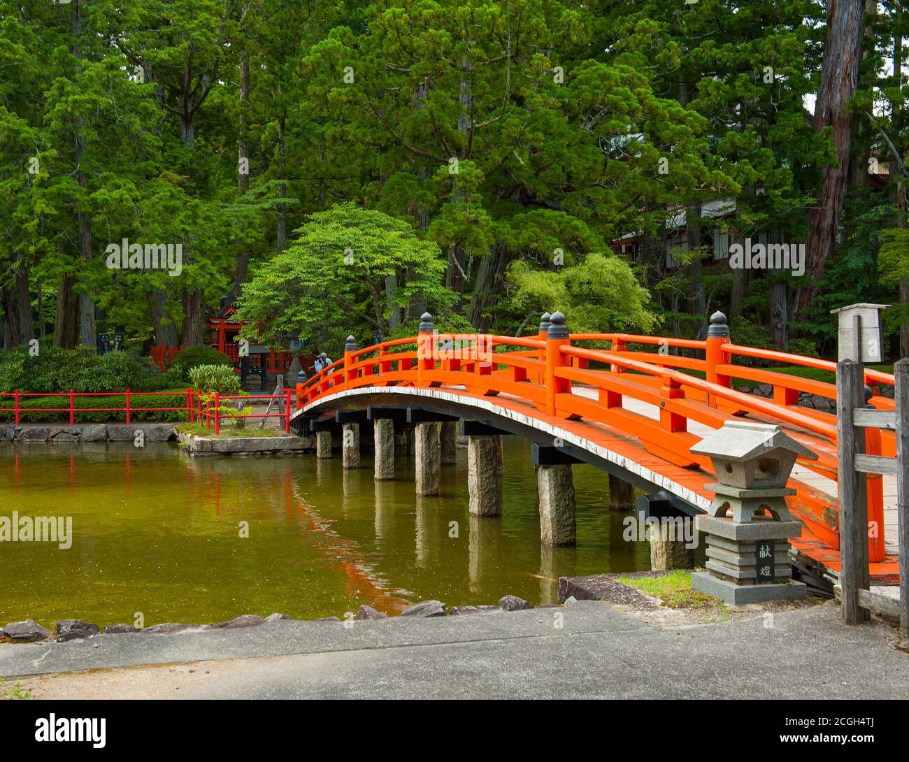 Beautiful traditional red bridge in Japanese Garden, Japan Stock Photo