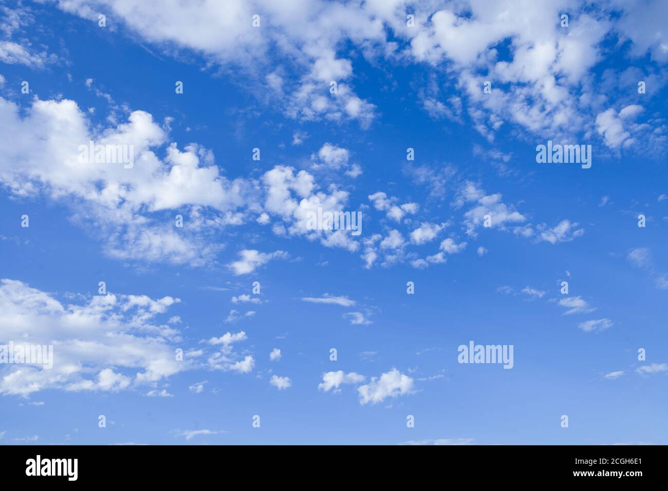 Blue sky background with tiny clouds. Stock Photo