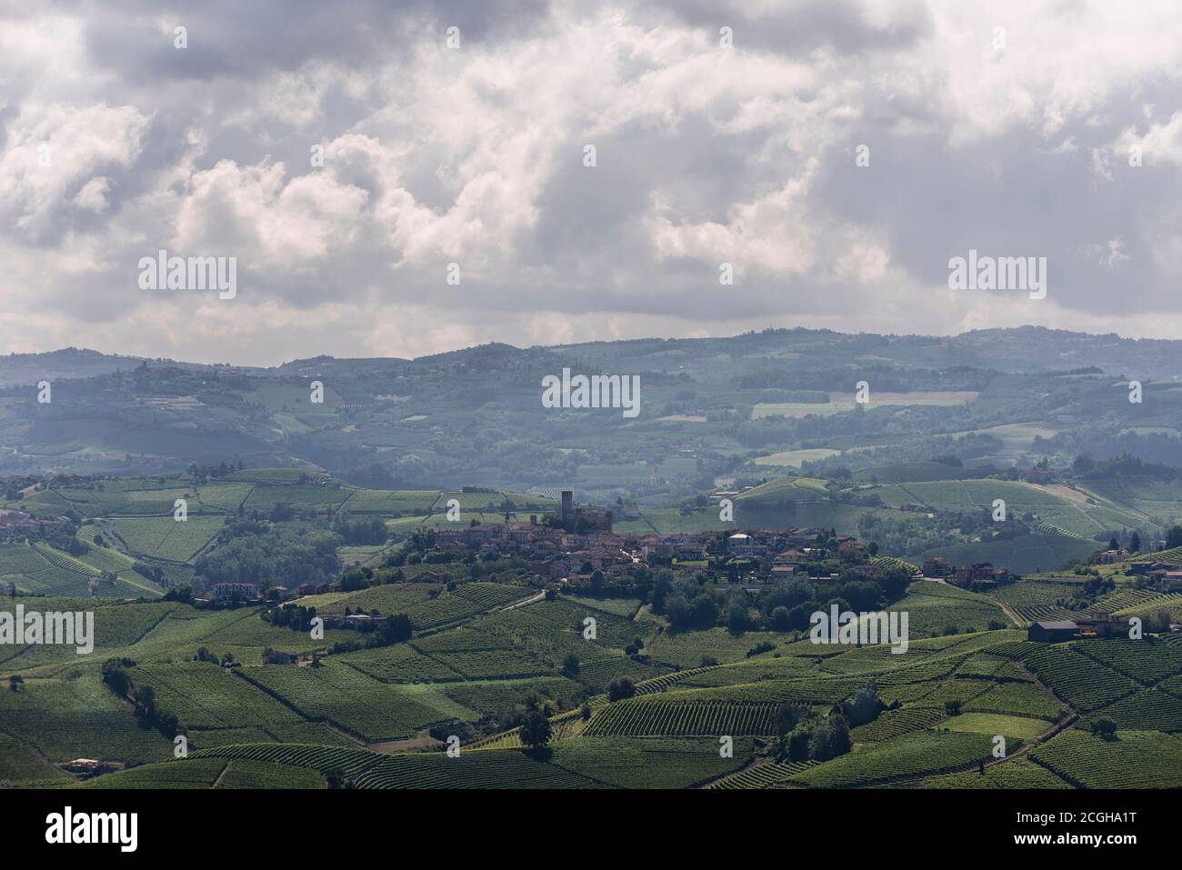 The vineyards and the lovely town of Barolo under a cloudy sky Stock Photo