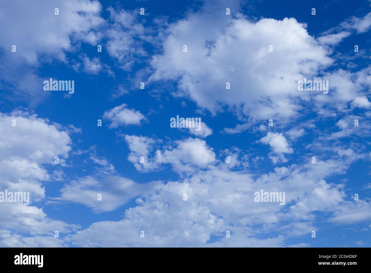 Blue sky background with tiny clouds. Stock Photo
