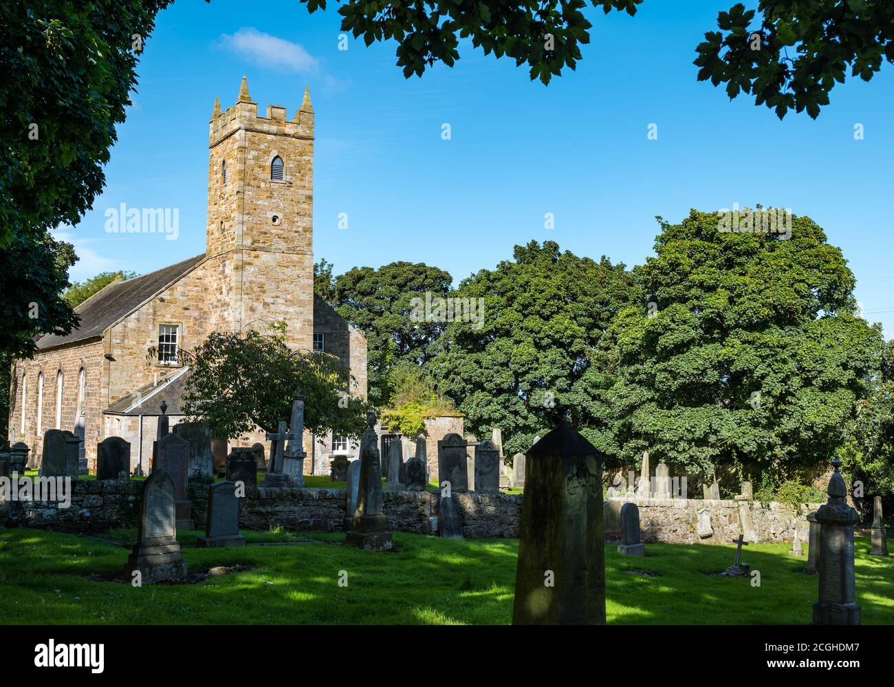 Tranent Parish Church, built 1800, and old graveyard on a sunny day, East Lothian, Scotland, UK Stock Photo