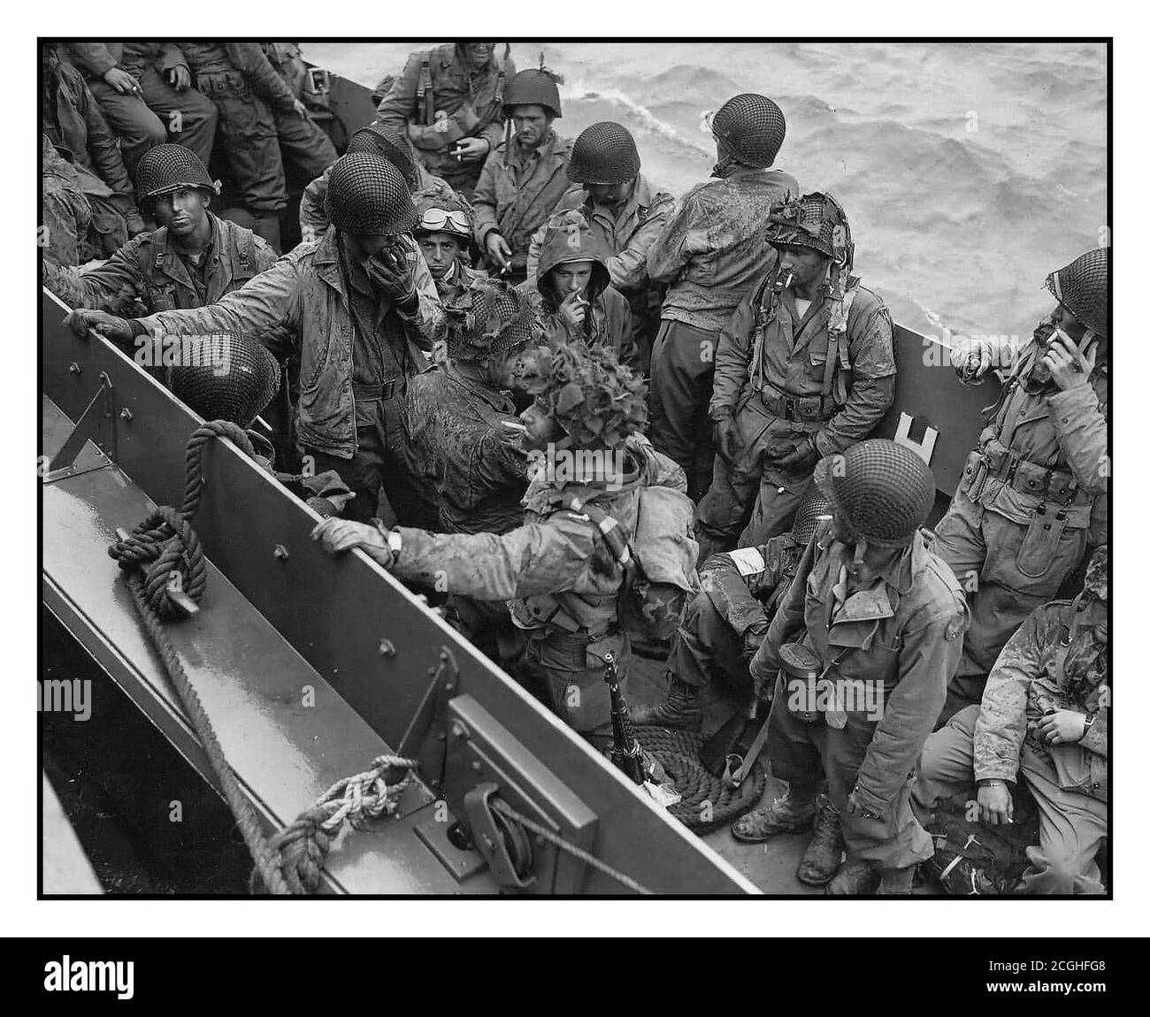 D-Day WW2 invasion glider pilots and support troops returning after successfully and courageously flying and landing troops behind enemy lines. Returning across the channel on troop landing craft 1944 Operation Overlord D-Day World War II Second World War Stock Photo