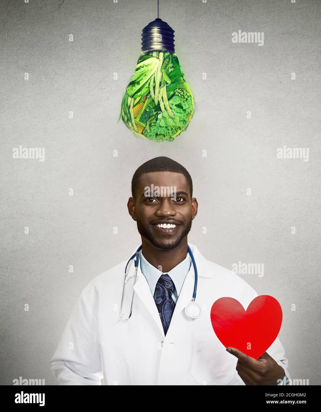 Portrait of a smiling doctor cardiologist advising on healthy diet for your heart Stock Photo