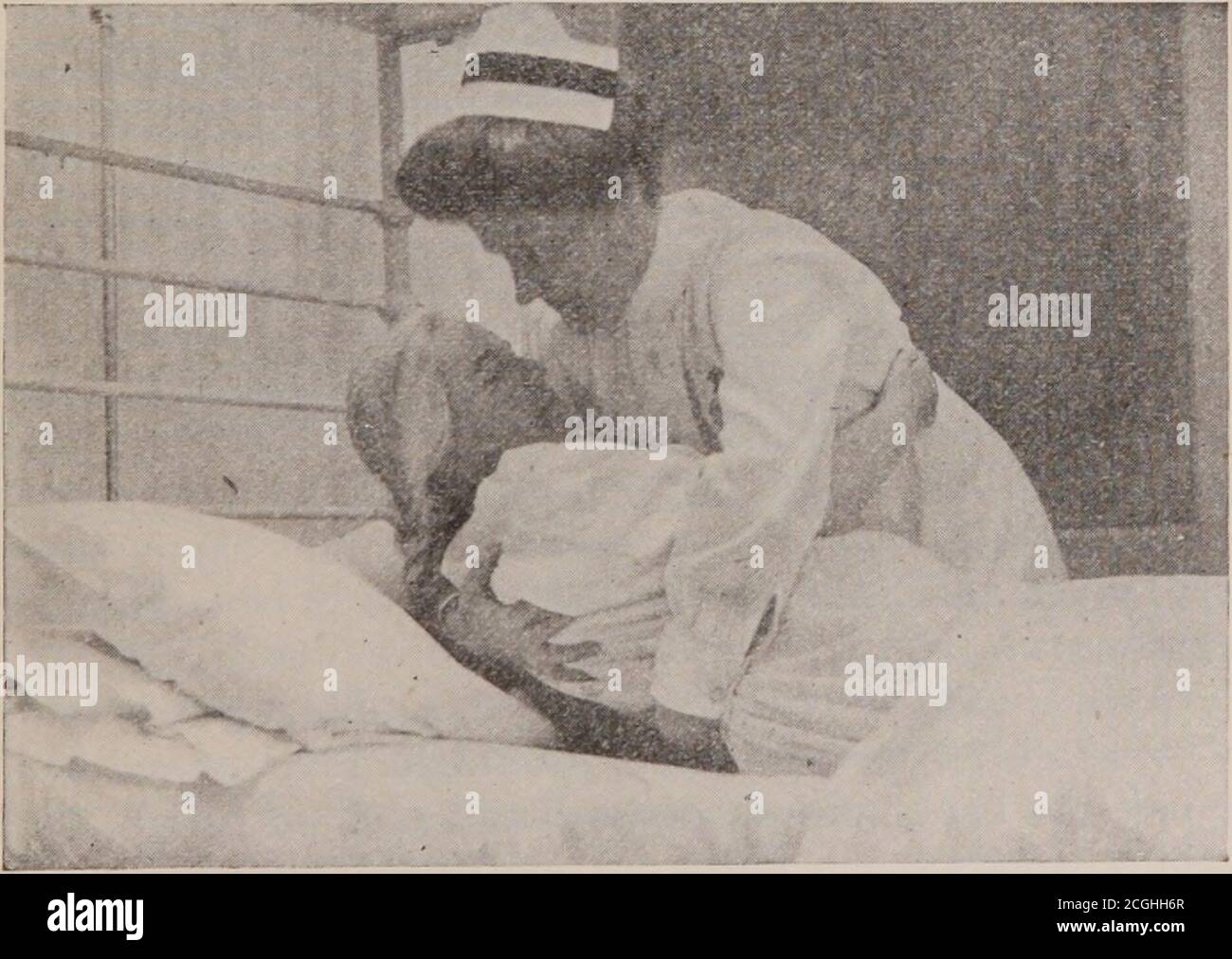 First-year nursing : a text-book for pupils during their first year of  hospital work . Fig. 18.—Turning patient in bed.. Fig. 19.—Lifting patient  in bed. 112 FIRST YEAR NURSING arm or