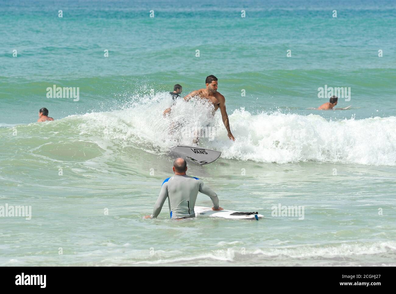HOLMES BEACH, ANNA MARIA ISLAND, FL / USA -  October 4, 2013: Surfers on Anna Maria Island taking advantage of the larger than normal waves in the Gul Stock Photo