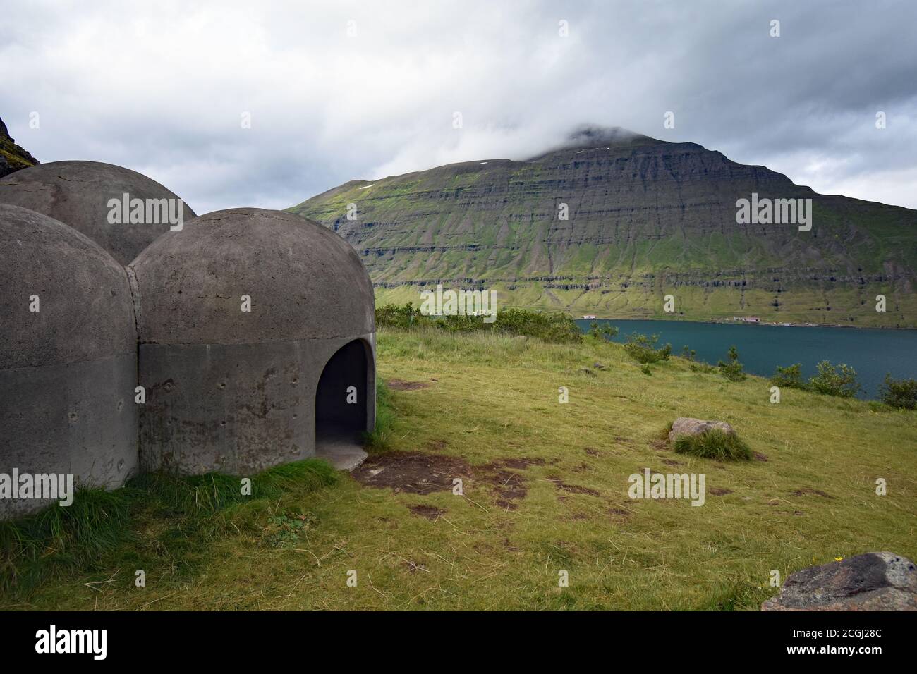 The Tvísöngur Sound Sculpture on a mountainside in Seydisfjordur, Eastfjords, Iceland.  The opposite side of the fjord can be see past the sculpture. Stock Photo