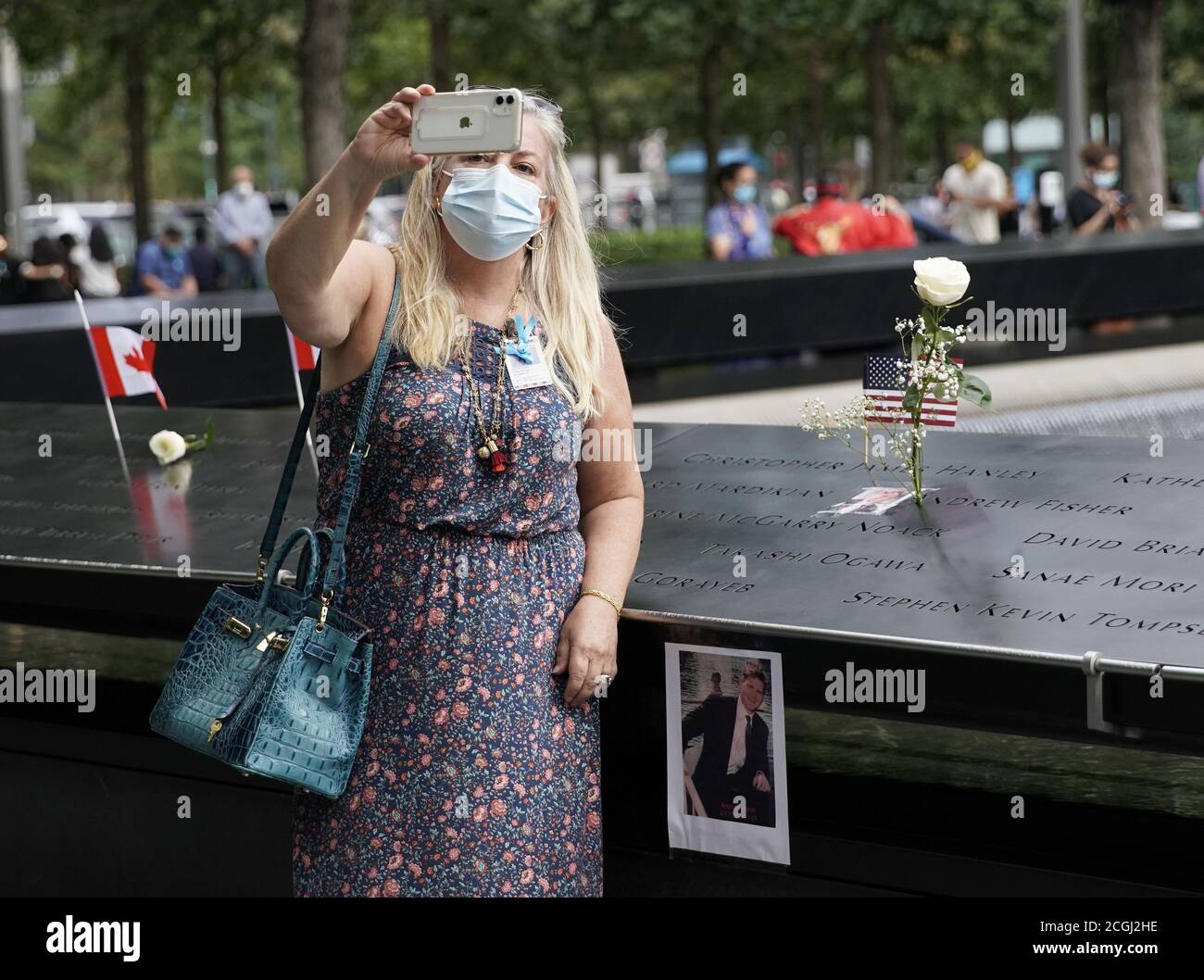 New York, United States. 11th Sep, 2020. A mourner takes a selfie at the 9/11 Memorial Reflecting Pools in Lower Manhattan near One World Trade Center on the 19th anniversary of the 9/11 terrorist attacks on the World Trade Center at Ground Zero in New York City on Friday, September 11, 2020. Photo by John Angelillo/UPI Credit: UPI/Alamy Live News Stock Photo