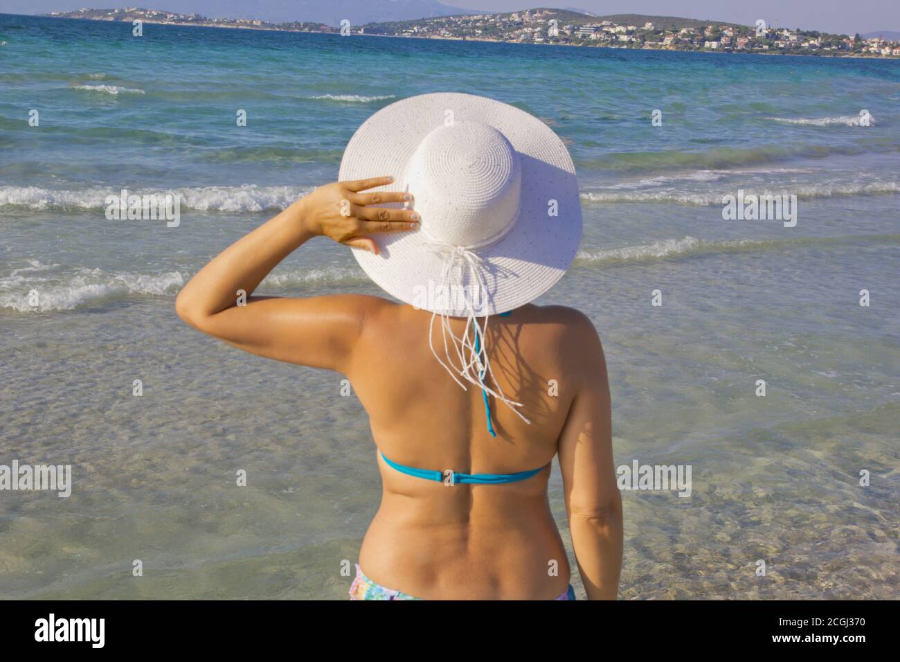 beautiful young woman in bikini on the beach Stock Photo