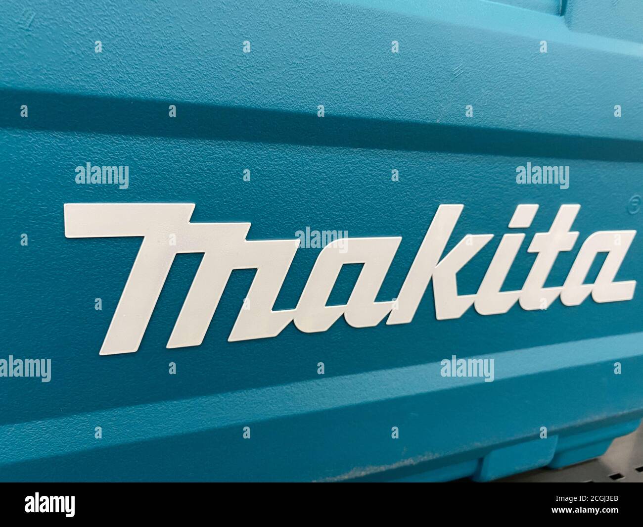 Viersen, Germany - July 9. 2020: View on isoalted makita logo lettering on  blue tool box with in german store (focus left Stock Photo - Alamy