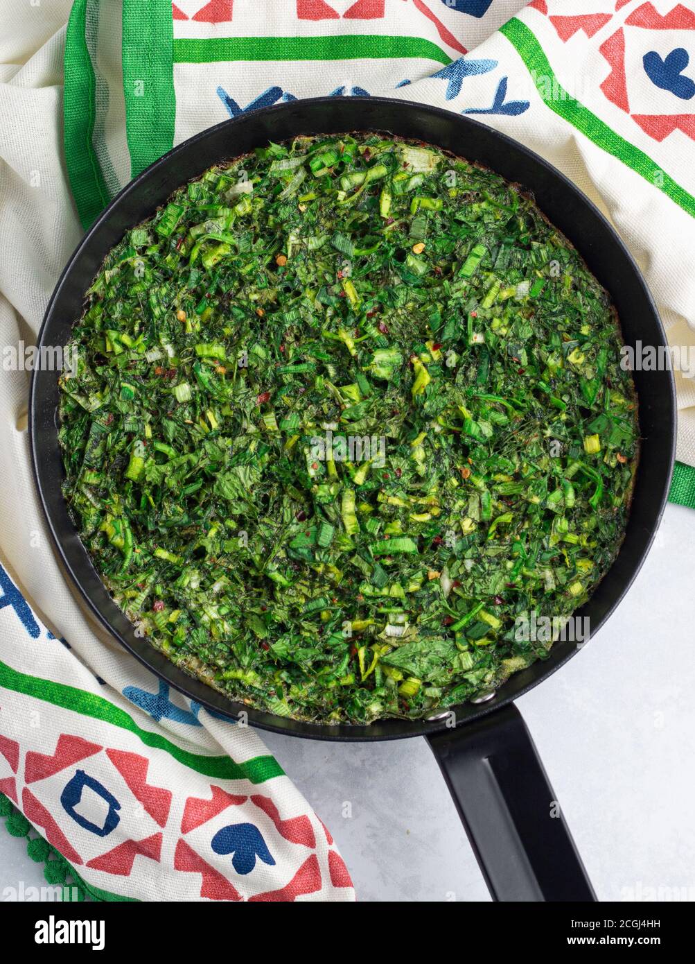 Kuku sabzi | Persian herb frittata in a pan Stock Photo