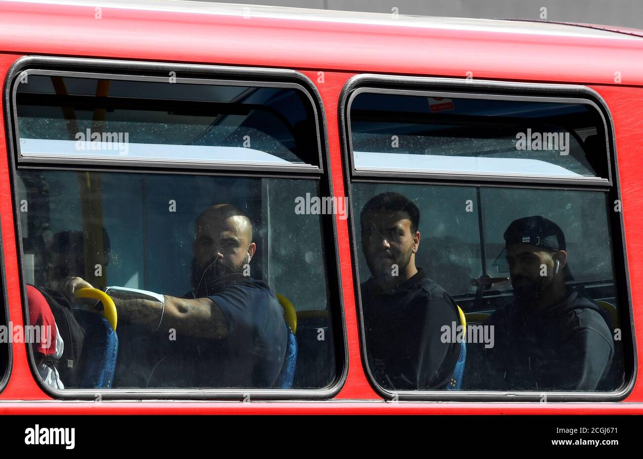 Passengers are seen on a London bus, whilst the reproduction 'R' number of COVID-19 infections in the United Kingdom has risen and may be above 1, the Government Office for Science said on Friday, indicating a risk that the overall epidemic is growing, London, Britain, September 11, 2020. REUTERS/Toby Melville Stock Photo
