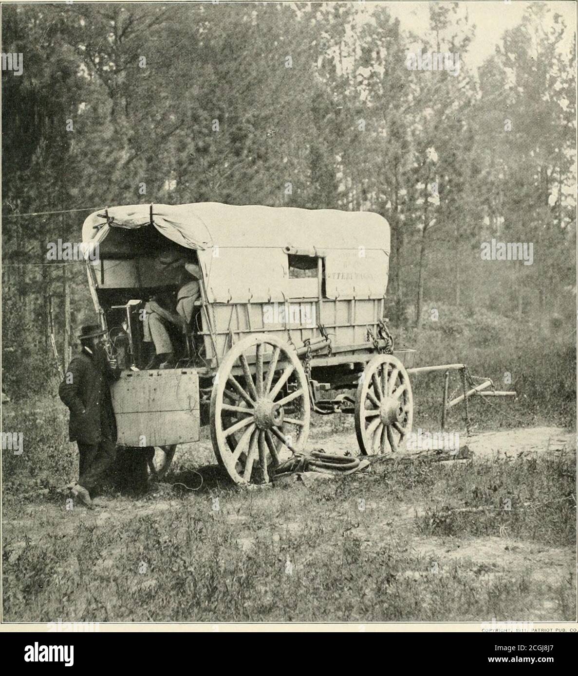 The photographic history of the Civil War : thousands of scenes  photographed 1861-65, with text by many special authorities . PATRIOT PUS.  CO. A TELEGRAPH BATTERY-WAGON NEAR PETERSBURG, JUNE, 18G4 The