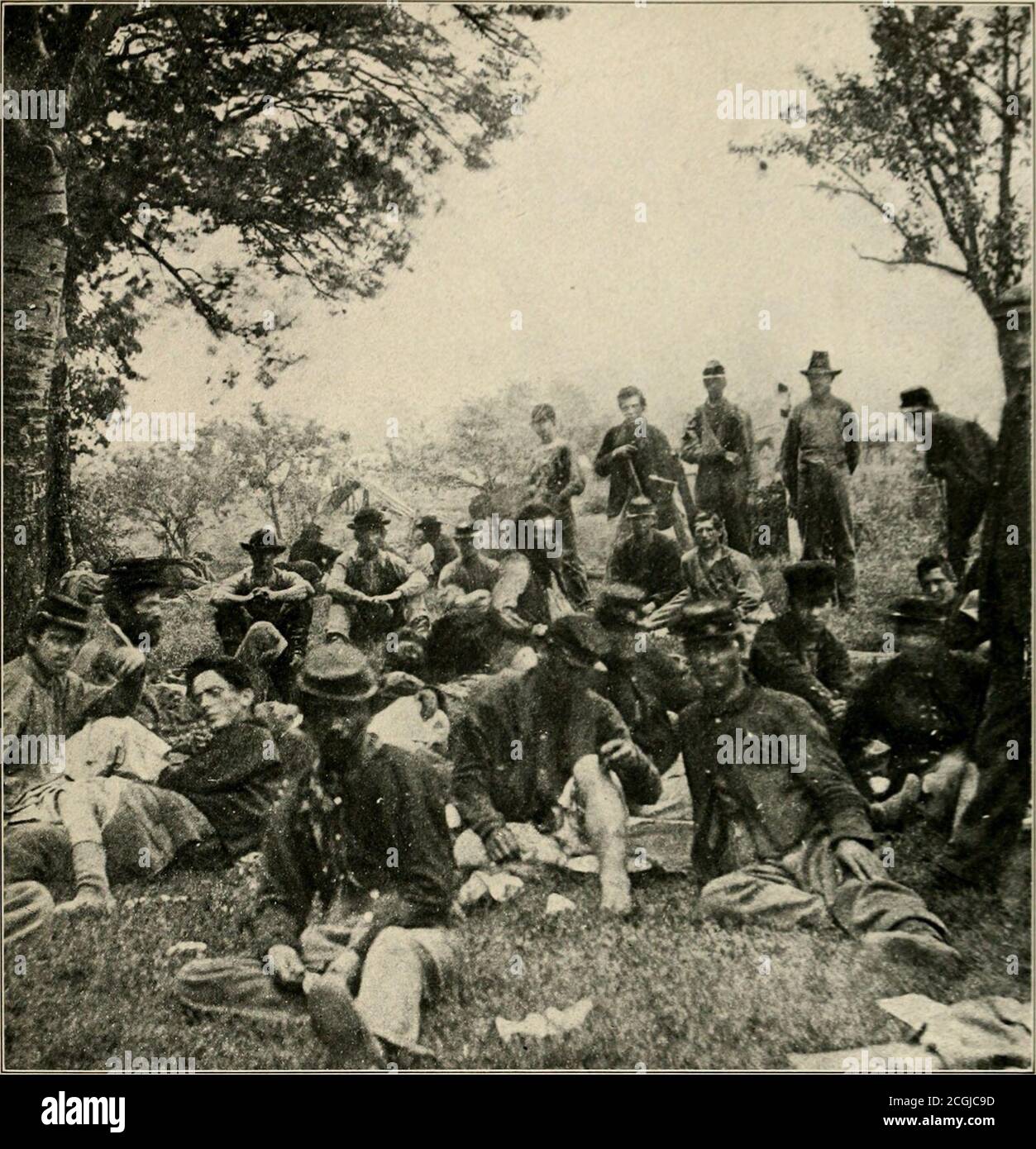 . The Photographic history of the Civil War : thousands of scenes photographed 1861-65, with text by many special authorities . WHERE BLUE AND GRAY WERE CARED FOR ALIKE—AFTER SPOTSYLYANTA In the battle of Spotsylvania, May 12, 1864, General Edward Johnsons division of seven thousand menwere taken prisoners at the salient known as Bloody Angle. Some of the wounded prisoners were plaeedin the same field hospitals as the Federals, and treated by the Union surgeons. They were left on thefield as the army moved on, and a small Confederate cavalry force under Colonel Rosser rescued all whocould be i Stock Photo