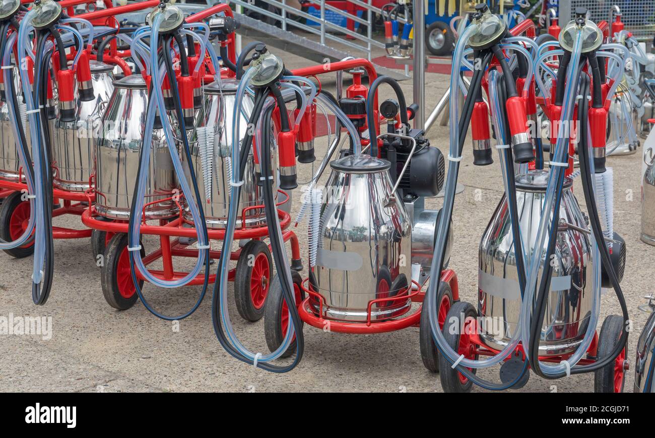 Portable Cow Milking Suction Machine at Dairy Farm Stock Photo Alamy