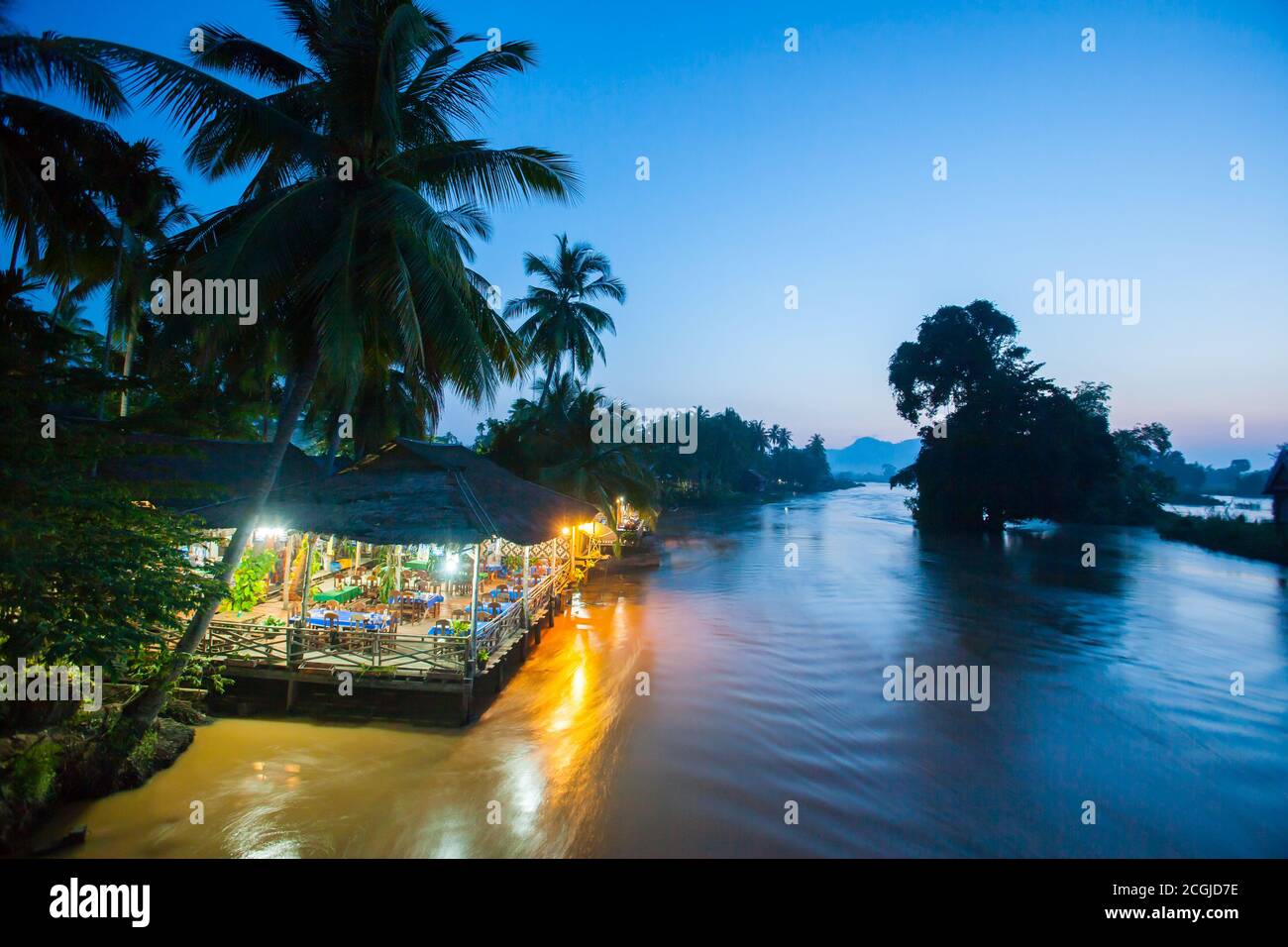Riverside restaurant near Mekong River at twilight. Don Det, Don Khon Island. Champasak Province, Laos. Stock Photo