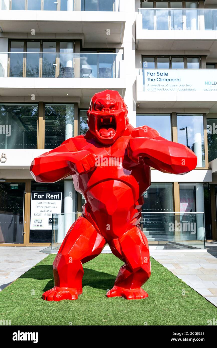 Sculpture of a red gorilla by French artist Richard Orlinski in Angel,  London, UK Stock Photo - Alamy