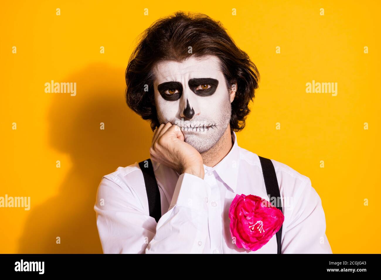 Photo of creepy scary sad monster creature bristled guy hand cheek almost cry failed find job underworld wear white shirt rose death costume Stock Photo