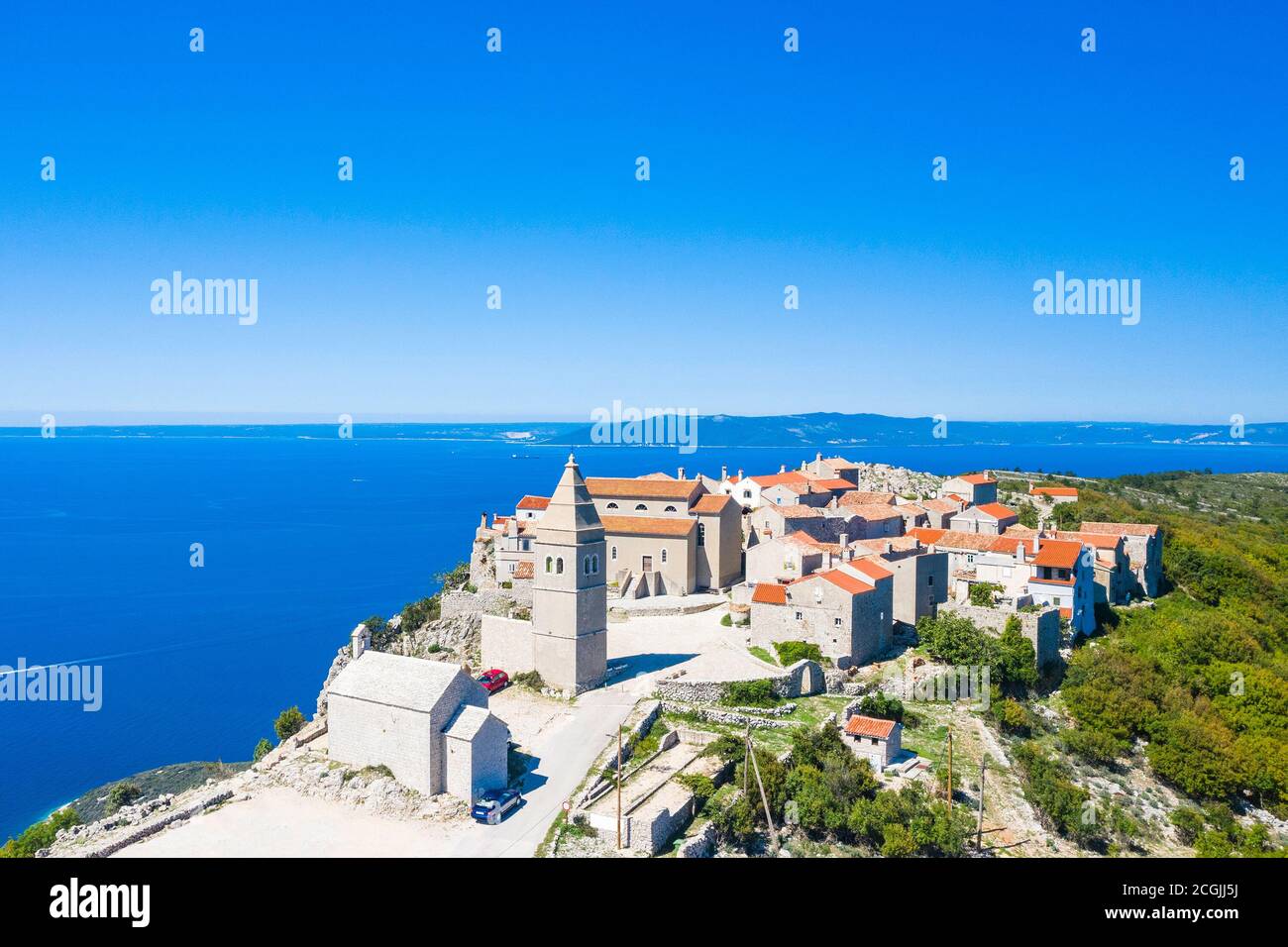 Amazing historical town of Lubenice on the high cliff, Cres island in Croatia, Adriatic sea in background Stock Photo