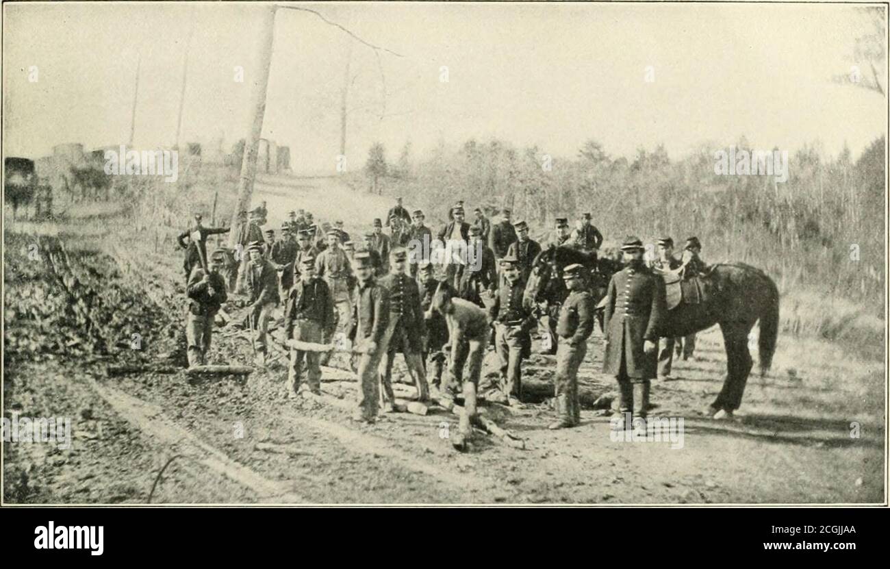 . The photographic history of the Civil War : thousands of scenes photographed 1861-65, with text by many special authorities . THE ADVANCE THAT BECAME A RETREAT Here, almost within sight of the goal (Richmond), we see McClellans soldiers preparing the way for the passage of the army and itssupplies. The soil along the Chickahominy was so marsh}- that in order to move the supply trains and artillery from the base atWhite House and across the river to the army, cordm-oy approaches to the bridges had to be built. It was well that the men got thisearly practice in road-building. Thanks to the wor Stock Photo