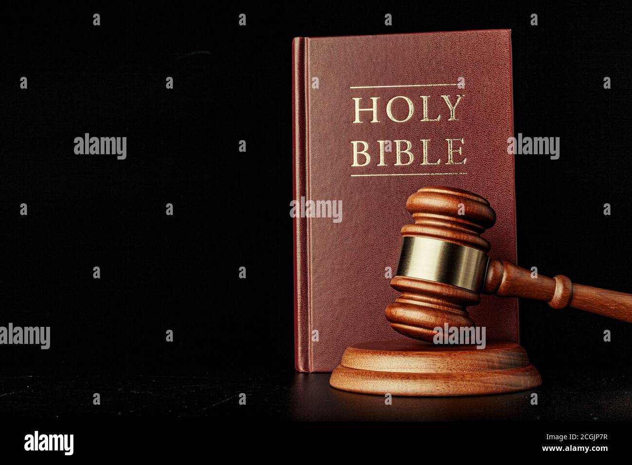 judge gavel with holy bible on black background Stock Photo Alamy