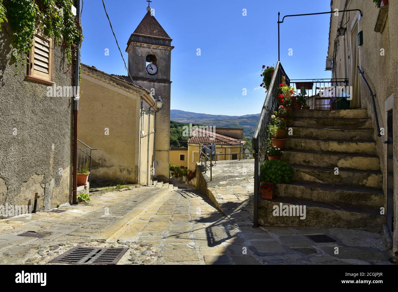 A narrow street among the old houses of Calvello, a rural village in ...