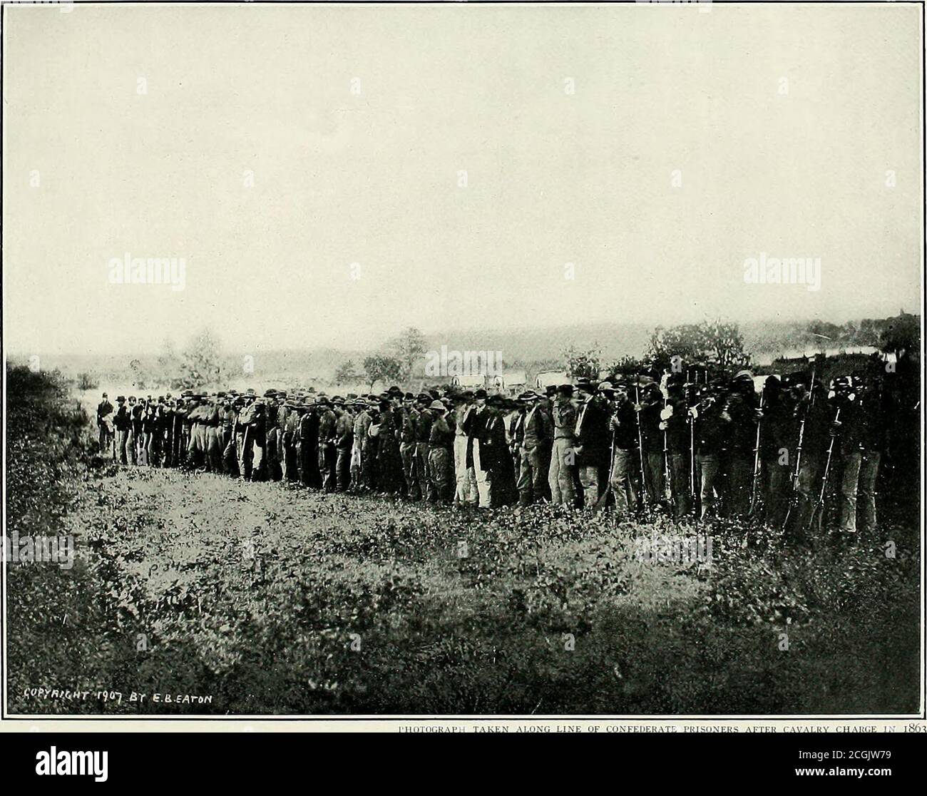 . Original photographs taken on the battlefields during the Civil War of the United States . IHUTUGKAPH TAKEN FTEK THE BATTLE OF CHANCELLORSVILLE IN 1S63—MAJOR-GENERAL JOSEPH HOOKER AND STAFF. THE retreat from Chancellors-ville began on the fourth ofMay, in 1863. In the midstof a pouring rain, with am-munition wagons and cavalry strug-gling hub-deep through the mud, theFederals moved back to the Rappa-hannock. The ponderous batteries,with heavy wheels wrapped in blan-kets, passed over the road. Thencame the ordnance supply trains,swathed in strips of cloth, followedby columns of hurrying infan Stock Photo