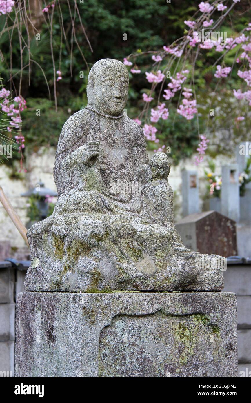 statue of a divinity (buddha ?) in a cemetery at the seikoin temple in