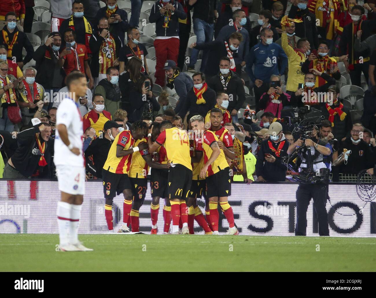 Ignatius Ganago of Lens celebrates his goal with teammates and the supporters during the French championship Ligue 1 football match between RC Lens (R Stock Photo