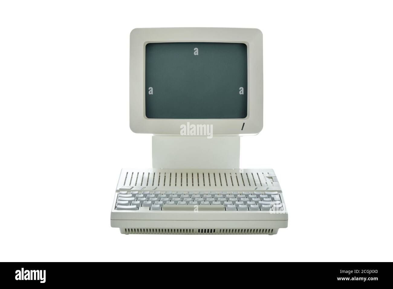 Vintage retro classic desktop computer from the eighties with integrated monitor and keyboard isolated on white background. Retro revival style front Stock Photo