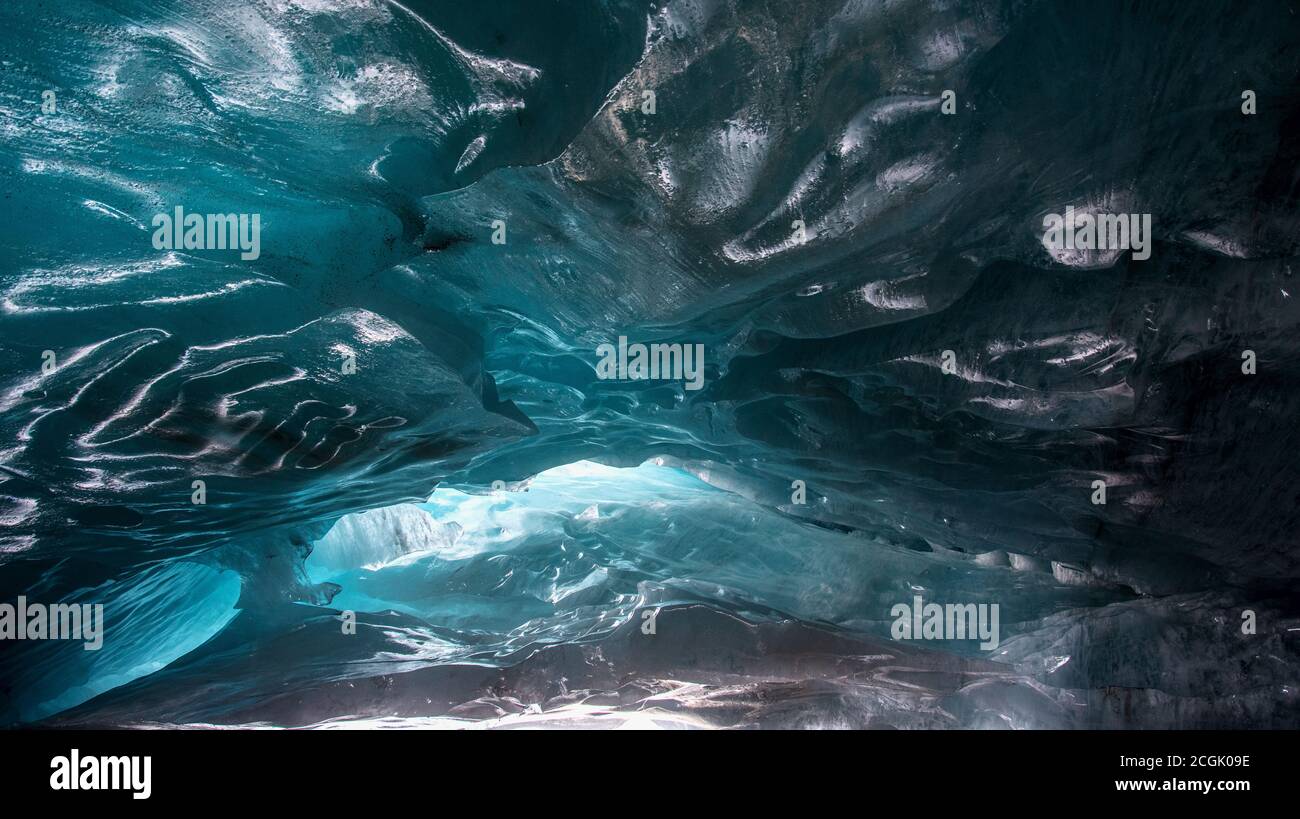 beautiful blue ice glacier cave grotto inside the mountain glacier ...