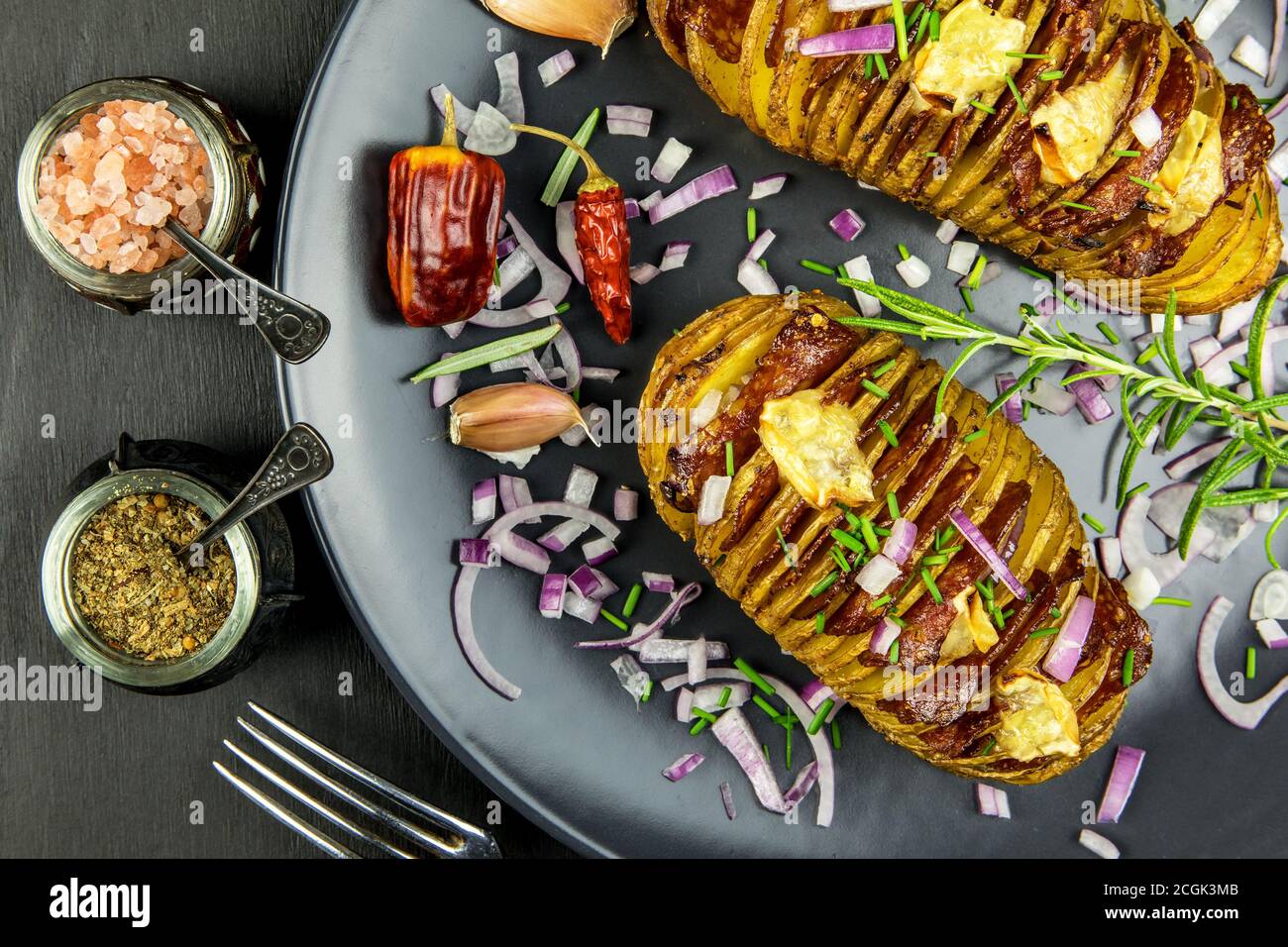 Freshly baked hasselback potatoes with chive. Appetizing potato